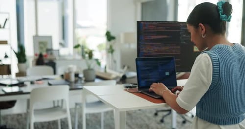 Back, computer screen and programming with business woman at standing desk in engineering office