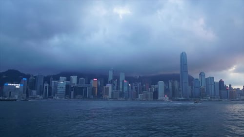 timelapse Hong Kong cityscape skyline with rainy clouds