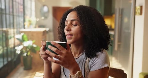 Woman Enjoying the Aroma of Fresh Coffee at Home
