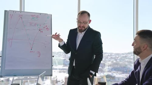 Business People in Meeting Presenting Data