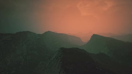 Dramatic Sky Over Rocky Mountains at Sunset