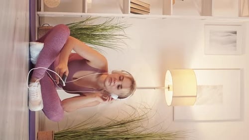 Woman Listening to Music and Dancing at Home