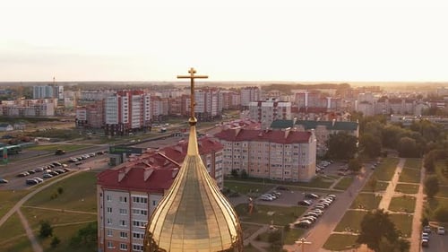 Aerial View of Beautiful Orthodox Church with Crosses on Golden Domes and New Microdistrict with