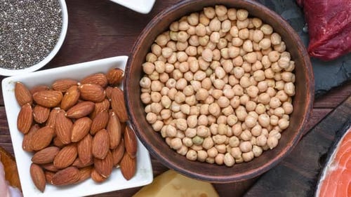 Various protein sources displayed on wooden background