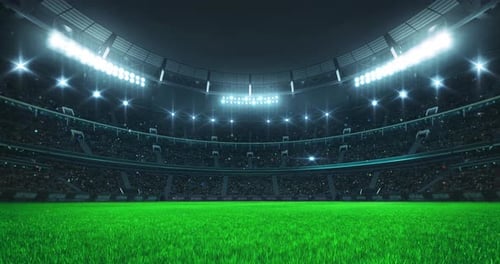 Bright Stadium Lights Illuminating Green Football Field At Night