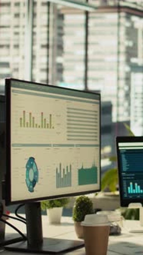 Vertical Video Modern Workspace with Key Performance Indicators Data on Display