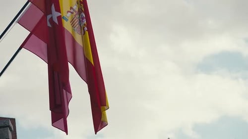 Spanish and Madrid Flags Waving in the Wind