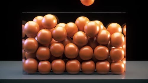 Animated 3D Orange Spheres Filling Transparent Box