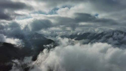 Aerial High View of Dramatic Clouds Flying