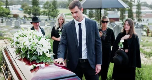 Mourners Gather at Cemetery for Funeral Ceremony