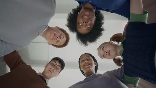 Group of Friends Huddled Together in Circle