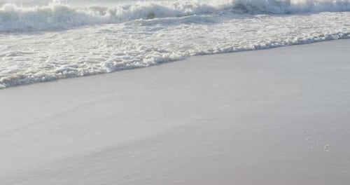 Video of calm sea waves and sand beach