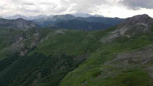 Incredible mountain panorama extending into the distance beyond the horizon. Aerial view.