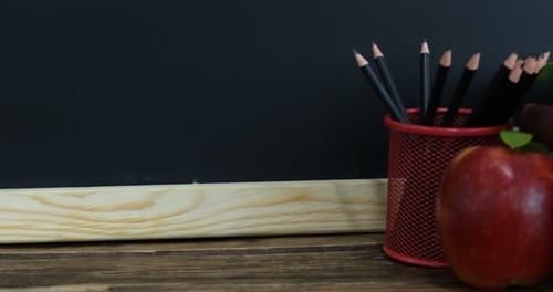 Back to School Still Life with Chalkboard, Books, Apple
