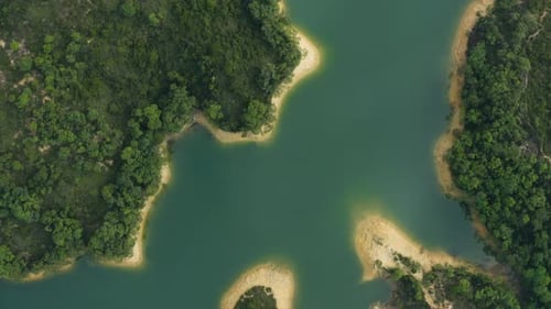 Drone view of beautiful reservoir and mountains in sunny day.