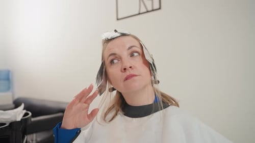 Woman with Foil in Hair at Hair Salon