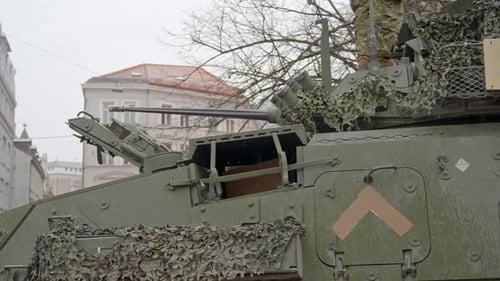 LAV 6 vehicle on public streets in Riga, Latvia, unrecognizable soldier on top
