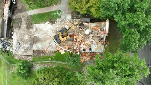 Aerial View of Excavator Demolishing a Building