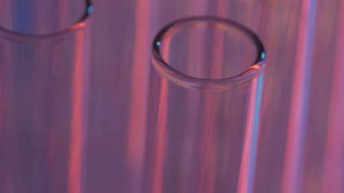 Close Up Video Neon Blue and Red Light Test Tubes in a Laboratory Scientific Experiment Research