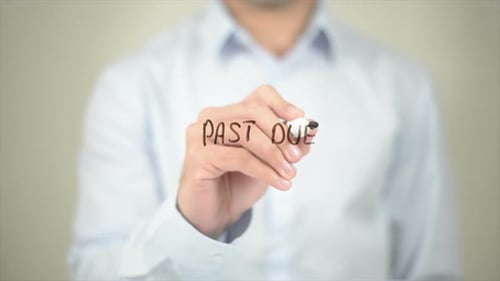 Past Due Man Writing on Transparent Screen