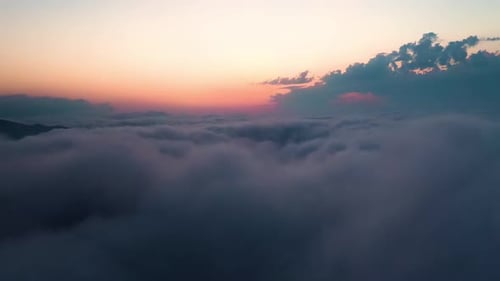 Aerial View of Clouds During Colorful Sunrise