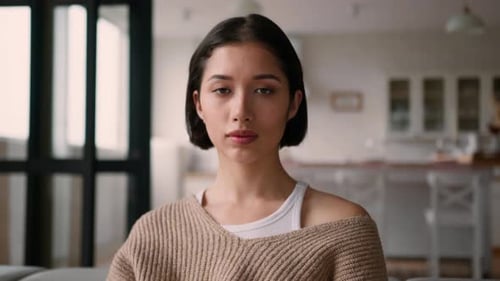 Young Woman Close Up Looking at Camera Indoors