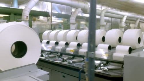 Inside the cotton mill, rows of cotton bobbin threads, manufacturing process