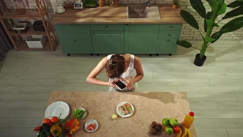 Young Woman at the Table in the Kitchen Preparing Spring Rolls for Healthy Lunch Top View Woman