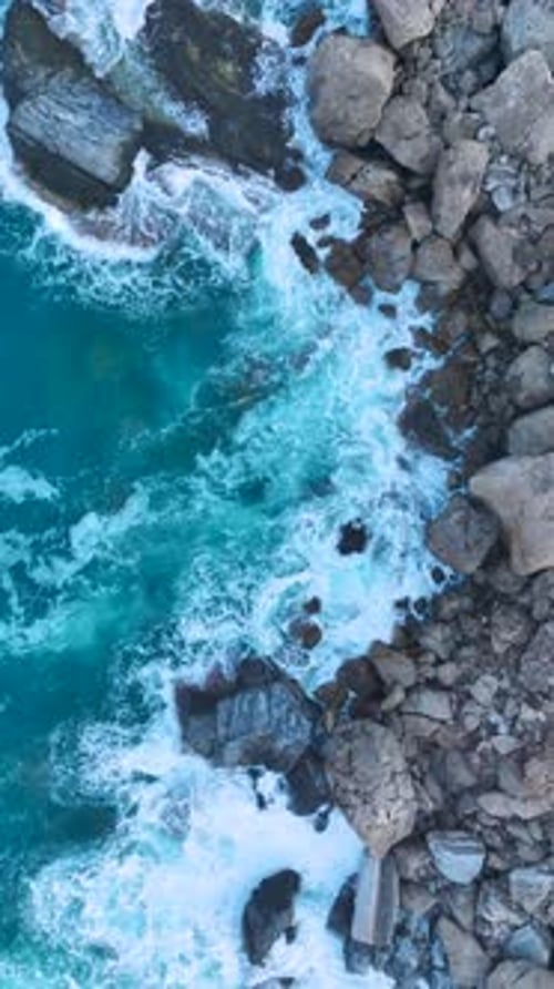 Vertical Video Epic Stormy Seas with Waves Breaking Against Cliffs on the Mediterranean Coastline in