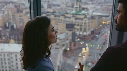 Couple Colleagues Communicating Standing Office Looking Window Cityscape Closeup