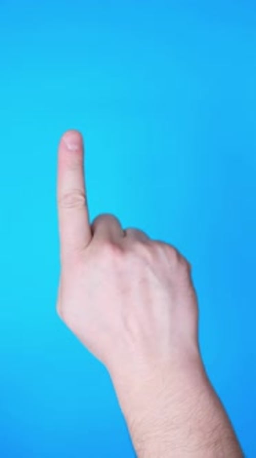 Hand Pointing to the Side Isolated on Blue Background Vertical Video