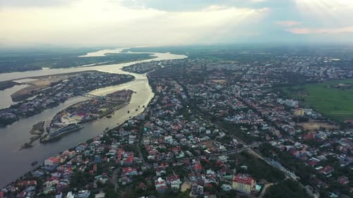 River, town and drone in neighborhood landscape with infrastructure, development or Vietnam village