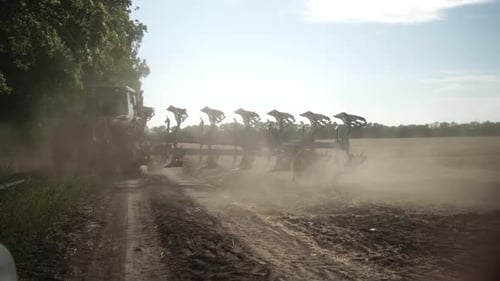 Tractors plowing the field in Ukraine