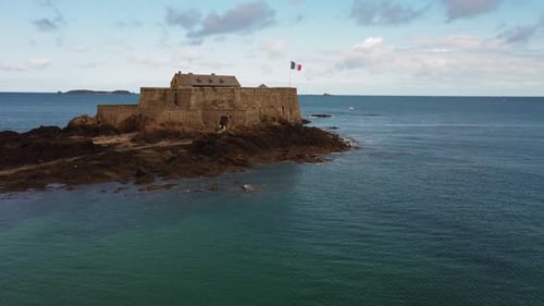 Fort on Petit Be tidal island at Saint-Malo, Brittany in France. Aerial circling