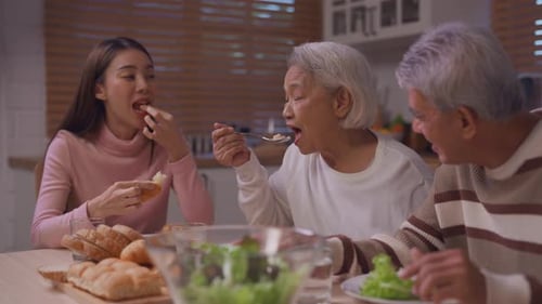 Family Enjoys Meal Together at Home