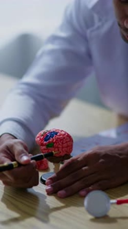 Doctor explaining about sickness and disease to patient and medical studeent in hospital