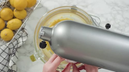 Step By Step Flat Lay Mixing Ingredients Into the Batter for Lemon Pound Cake