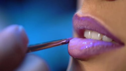 Applying Glamorous Mauve Lipstick with Brush