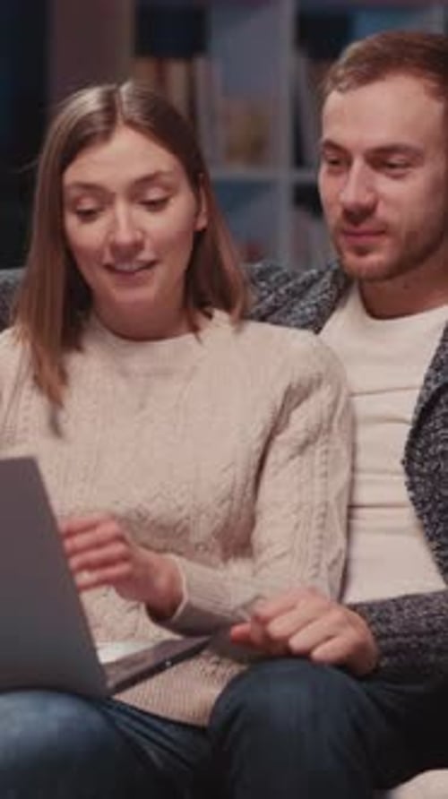 Couple Using Laptop at Home Together