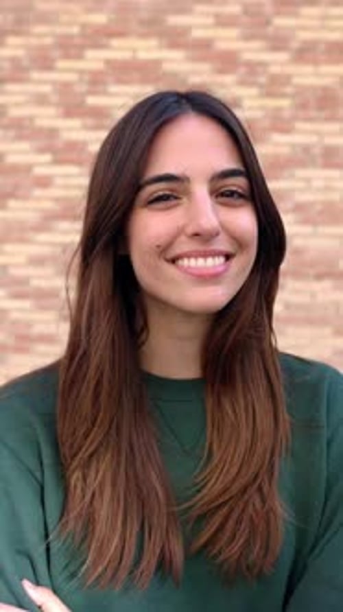 Close Up Outdoor Portrait of Cheerful Young Attractive Woman Smiling at Camera