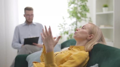 Woman Talking to Therapist During Counseling Session