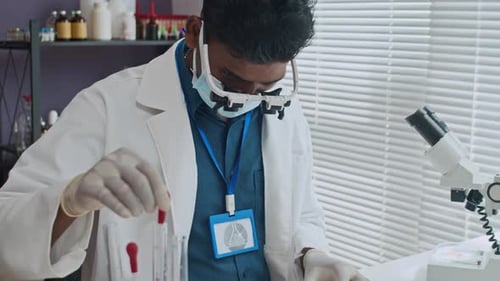 Indian Scientist Growing Bacteria in Petri Dish