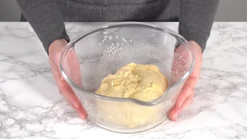 Time Lapse Step By Step Rising Brioche Dough in a Glass Mixing Bowl on the Kitchen Counter