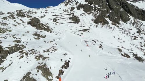 Aerial view of skiers on mountain slope, France.