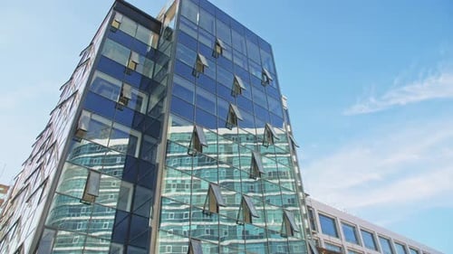 Highrise Office Building with Shiny Glass Facade at Downtown