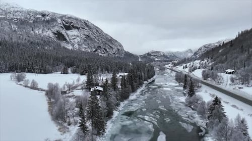 video flying frozen river in norway with drone