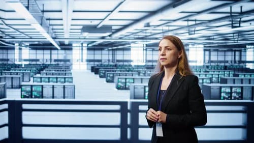 System Administrator in High Tech Data Center Looking at Hologram Visualization