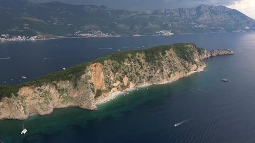 Beautiful rocky island in the middle of the sea. Aerial view.