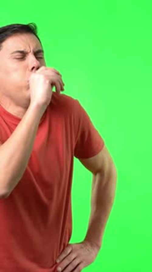 Man Coughing and Putting on Medical Mask