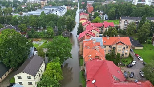 Aerial view of a flooded city in Latvia, after rain on a cloudy day